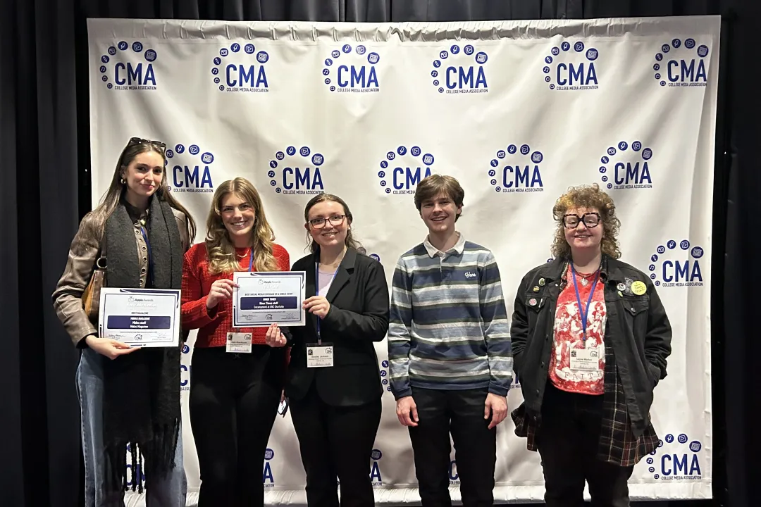 Students holding their awards for Student Niner Media