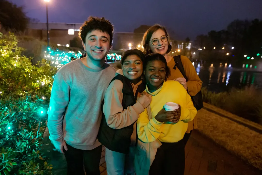 Students smiling at the Light Up The Lake event